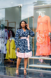 Navy blue skater dress with pink hem.
